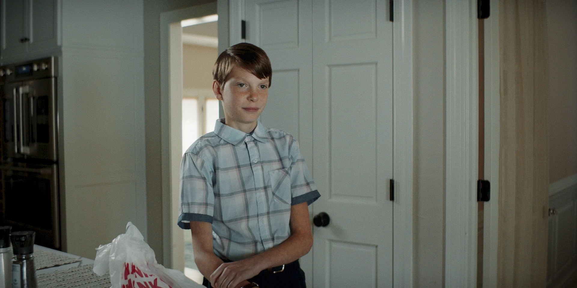 Griffin in the kitchen doorway